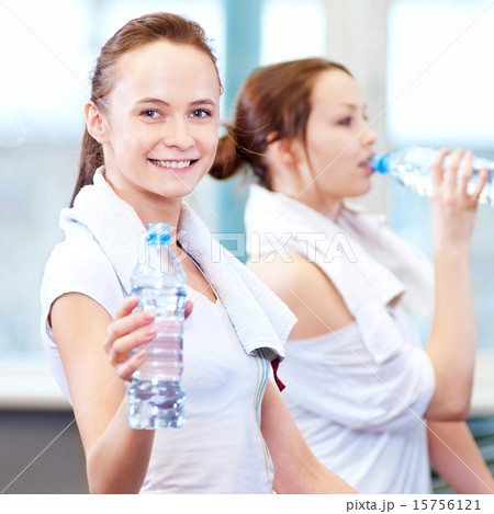 Women drinking water after sports Women drinking water after sports 15756121