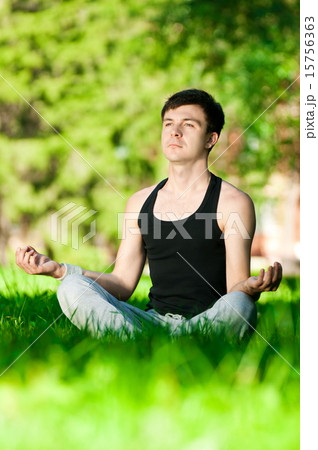A young man doing yoga exercise A young man doing yoga exercise 15756363