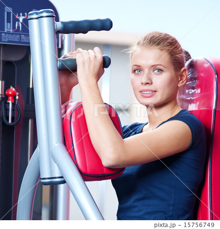 Woman at the gym exercising Woman at the gym exercising 15756749