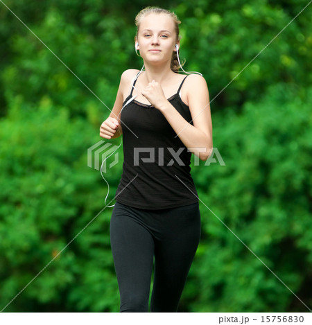 Young woman running in green park 15756830