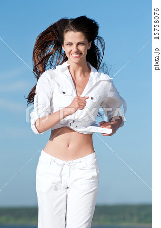 Sporty woman running in sea coast 15758076
