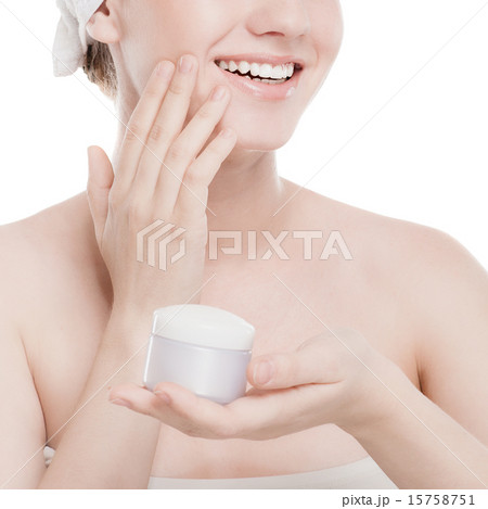 Woman applying moisturizer cream on face Woman applying moisturizer cream on face 15758751