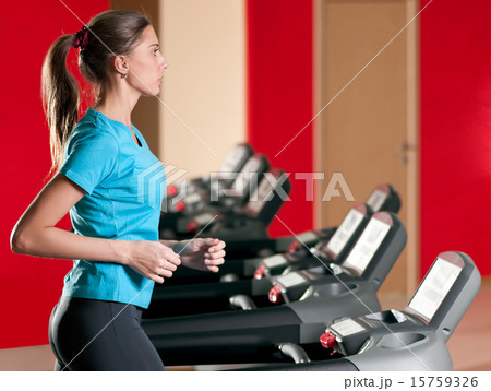 Gym exercising. Run on on a machine. 15759326