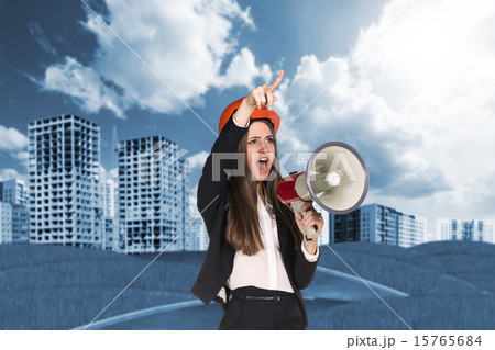 Woman in hardhat screaming in megaphone Woman in hardhat screaming in megaphone 15765684