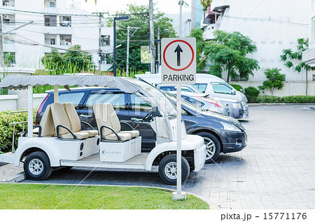Cars on a parking lot and parking sign 15771176