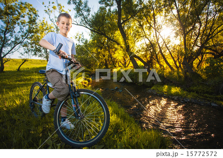happy funny kid on bicycle. Active Leisure 15772572
