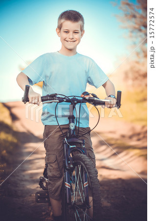 happy funny kid on bicycle. Active Leisure happy funny kid on bicycle. Active Leisure 15772574