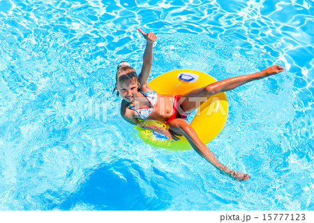 Child swimming on inflatable beach mattress. Child swimming on inflatable beach mattress. 15777123