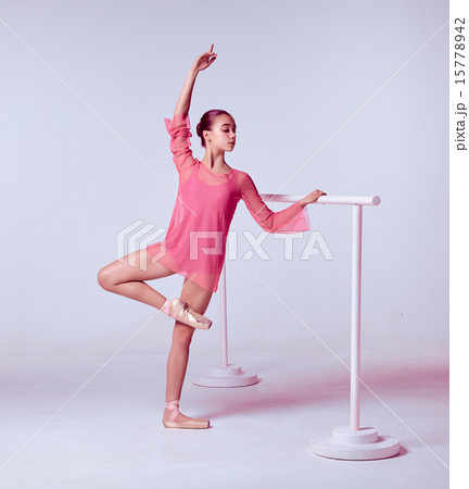 Ballerina stretching on the bar 15778942