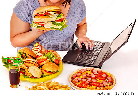 Woman eating junk food. Woman eating junk food. 15783948