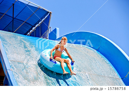 Child on water slide at aquapark. Child on water slide at aquapark. 15786758