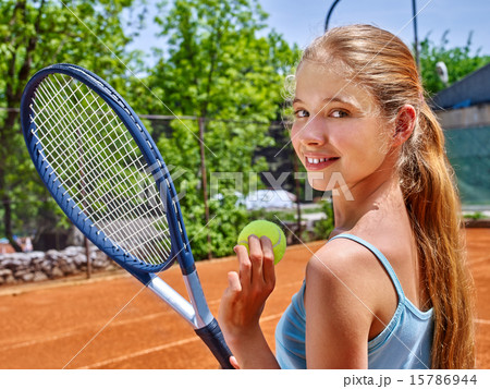 Girl sportsman with racket and ball on  tennis court 15786944