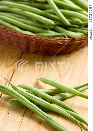 bean pods on wooden table 15789197