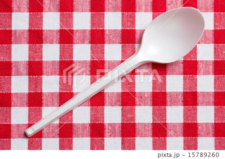 plastic spoon on checkered tablecloth plastic spoon on checkered tablecloth 15789260