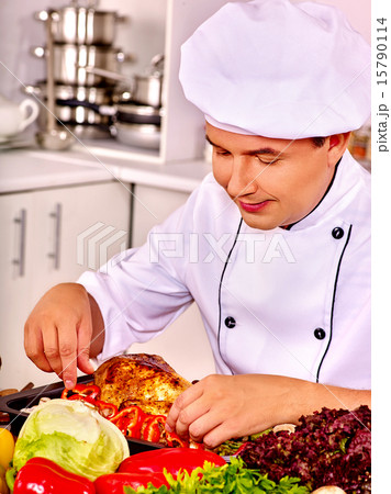 Man in chef hat cooking chicken Man in chef hat cooking chicken 15790114