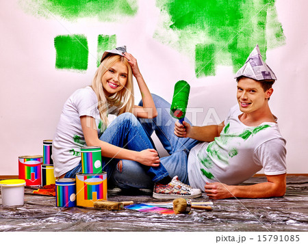 Woman paint wall at home. Woman paint wall at home. 15791085