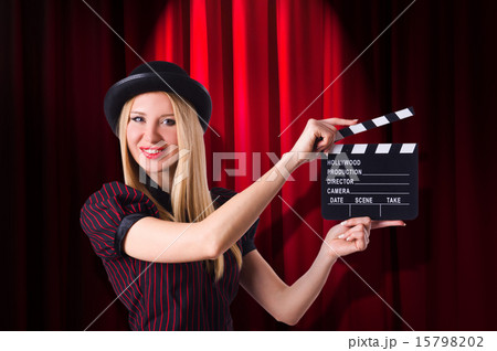 Woman gangster with movie clapper Woman gangster with movie clapper 15798202