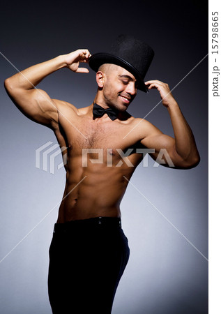 Muscular man in dark studio Muscular man in dark studio 15798665