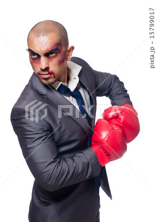 Badly beaten businessman with boxing gloves 15799017
