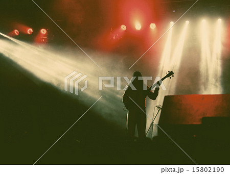 Guitarist silhouette in smoke during concert 15802190