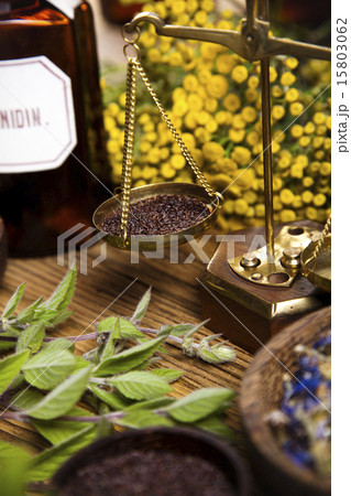 Assorted natural medical herbs and mortar 15803062