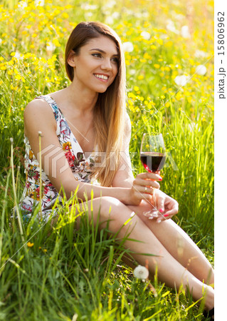Young beautiful woman drinking wine outdoors Young beautiful woman drinking wine outdoors 15806962