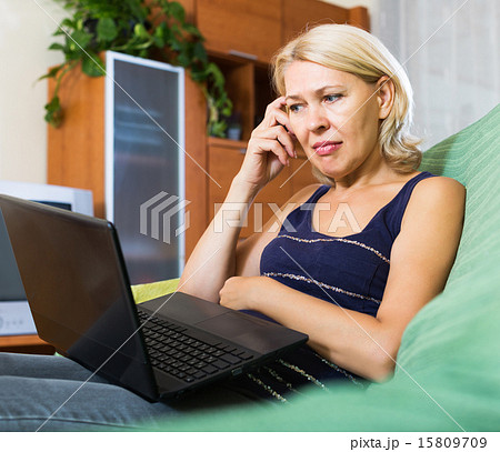 Senior woman watching soap show 15809709