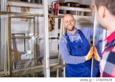 Two smiling workmen at factory 15809928