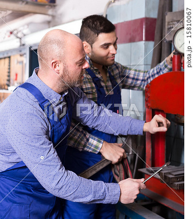 Repairmen in a workshop Repairmen in a workshop 15810067