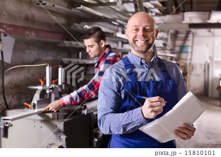 Worker at factory with boss Worker at factory with boss 15810101