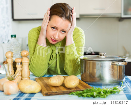 Woman needs to make dinner Woman needs to make dinner 15810347