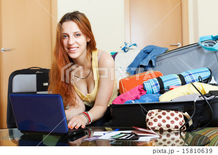 Young woman buying tickets online 15810639