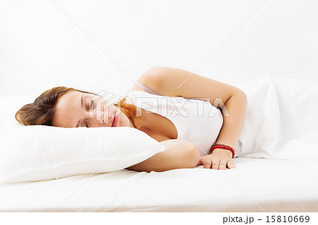 Pretty girl in shirt sleeping on white 15810669