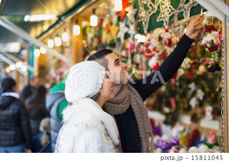 Couple choosing Christmas decoration Couple choosing Christmas decoration 15811045