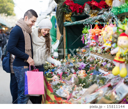 Couple buying Christmas flower at market 15811144