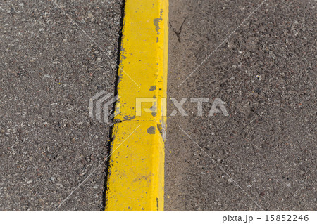 Yellow curb stone border 15852246