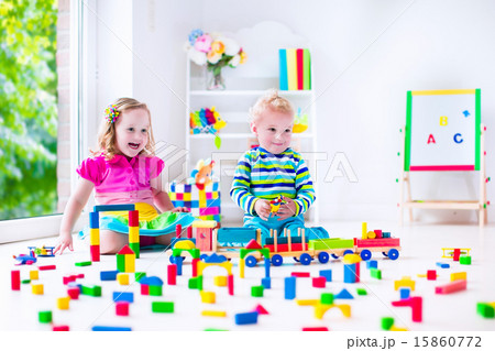 Kids playing at day care with wooden toys 15860772