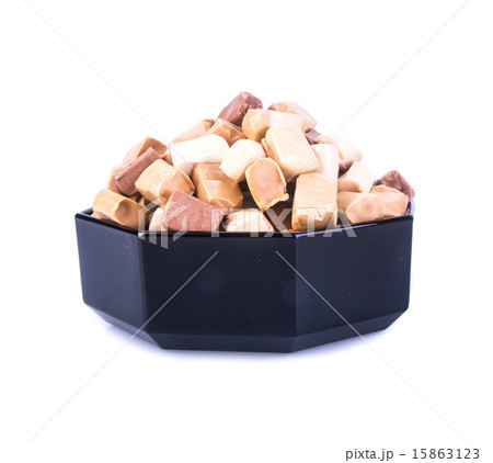 caramel candies on a background. caram caramel candies on a background. caram 15863123