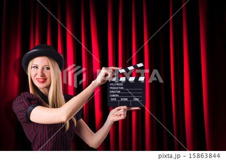 Woman gangster with movie clapper Woman gangster with movie clapper 15863844