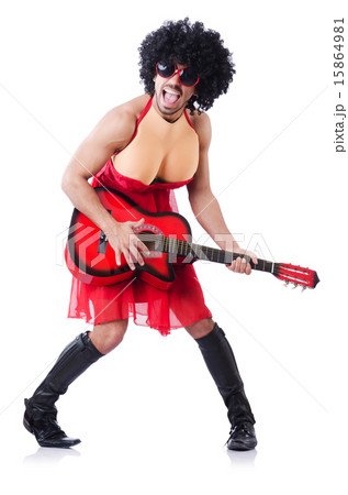 Man in woman clothing with guitar Man in woman clothing with guitar 15864981