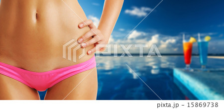 Woman at tropical swimming pool Woman at tropical swimming pool 15869738