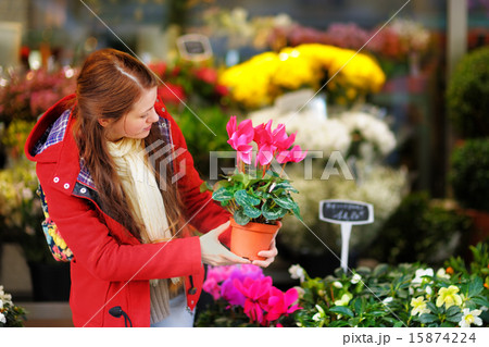 Young woman selecting fresh flowers Young woman selecting fresh flowers 15874224