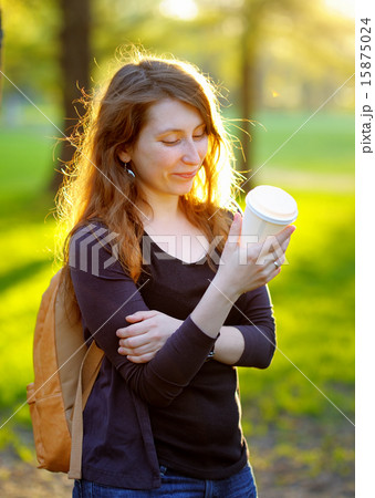 Young woman drinking coffee Young woman drinking coffee 15875024