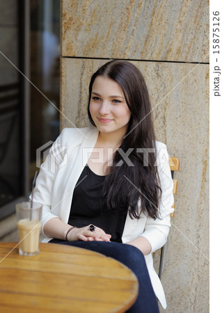 Young woman in outdoor cafe 15875126
