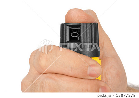 Hand with bottle of pepper spray 15877578