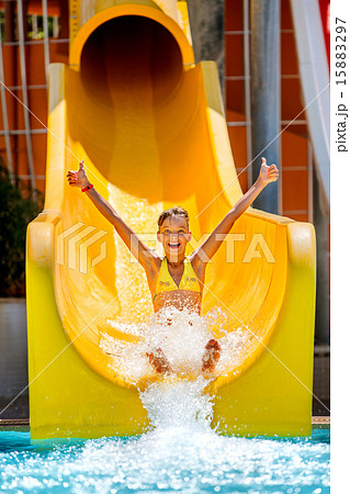 Child on water slide at aquapark. 15883297