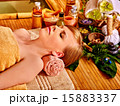 Woman getting massage in bamboo spa. 15883337