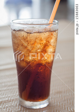 A glass of cola with ice 15883663