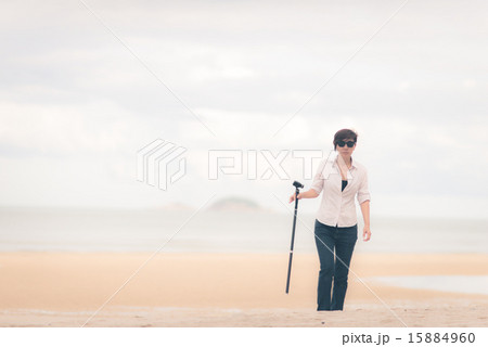 Smart Asian photographer wearing sunglasses  15884960