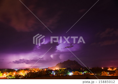 Anonymous city at sunset under cloudscape 15885012